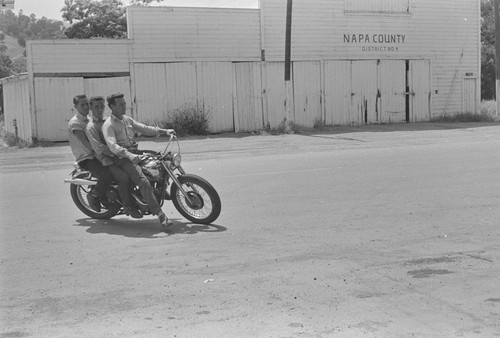 Three young men on a motorcycle, Napa County, District No. 4, Berryessa Valley