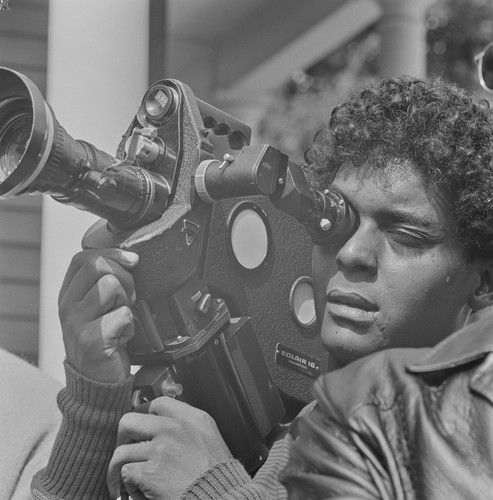 Motion picture photographer, photographing at Free Huey Rally, Bobby Hutton Memorial Park, Oakland, CA, #117 from A Photographic Essay on The Black Panthers