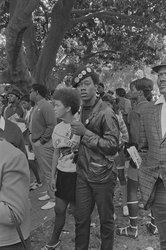 Black Panther couple listening, Free Huey Rally, DeFremery Park, Oakland, CA, #20 from A Photographic Essay on The Black Panthers