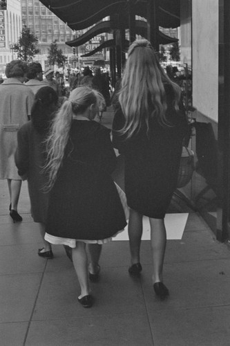 Two young girls with long blond hair, walking by Macy's, from back, #19 from Illusion For Sale, San Francisco