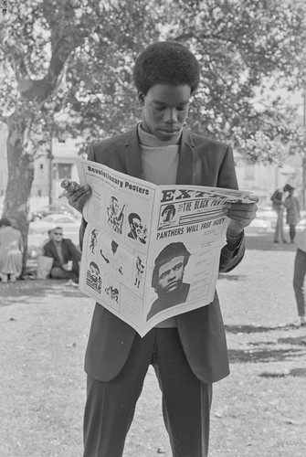 Reading the Black Panther paper at Bobby Hutton Memorial Park, Oakland, CA, #37 from A Photographic Essay on The Black Panthers