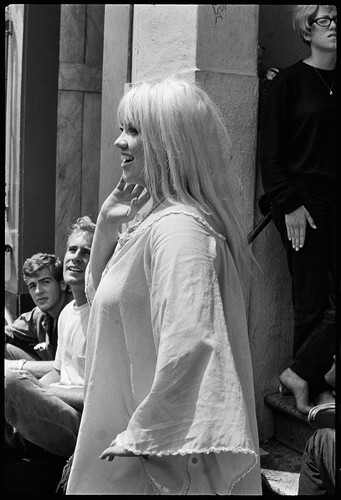 Girl singing on steps, Haight Ashbury 1967