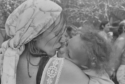 Mother kissing child, Black Point, Marin County