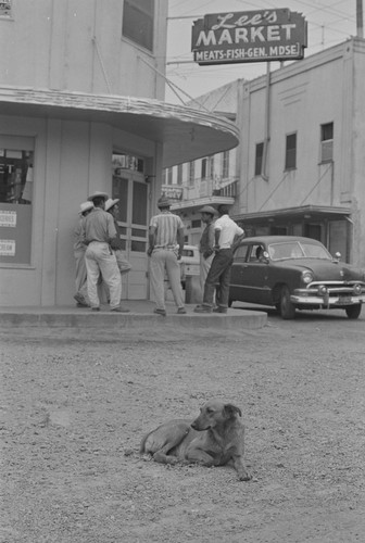 Dog and men at Lee's Market, from Walnut Grove