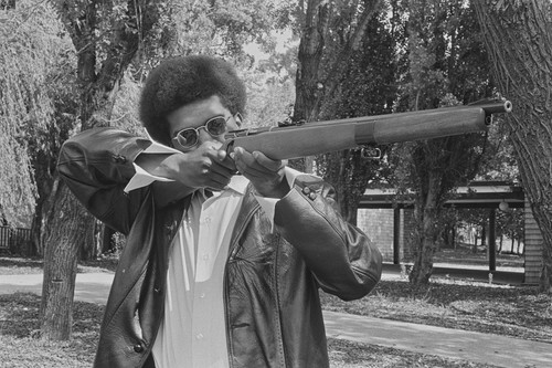 Black Panther with his gun, Marin City, CA, #52 from A Photographic Essay on The Black Panthers