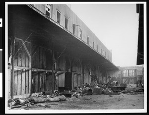 Dilapidated structure and ruined alleyway with trash and debris on ground, Chinatown, 1939