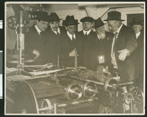 Interior view of an observatory showing astronomers on tour, ca.1920-1930