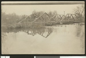Wooden bridge over a body of water, ca.1900