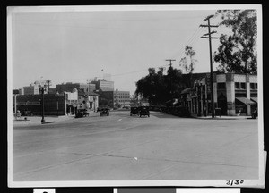 Intersection of Cahuenga Boulevard and Yucca Street showing street after widening and paving had been completed, 1930-1939