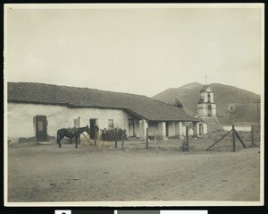 Mission Asistencia of San Antonia at Pala, showing a horse outside a barbed-wire fence, ca.1900