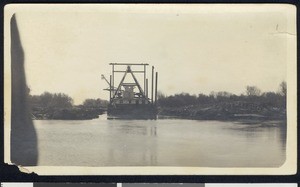 Structure (possibly a steam boat?) on a body of water, ca.1910