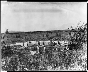 View of the old fountain at the San Fernando Mission, shown in its original location, ca.1900