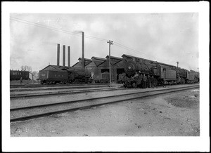 United States Army railroad yard in France showing trains and soldiers, ca.1915