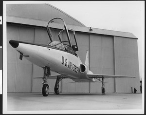 T-38 Supersonic Trainer parked outside hangar, ca.1960