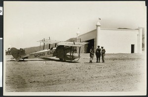 Three men standing by the "Mono Eagle" biplane on the Brand Airfield in Glendale, CA, ca.1927