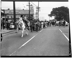 Parade making its way down the Macy Street (now Cesar E. Chavez Ave.) in Los Angeles