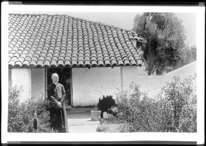 Father Edward Doyle standing outside Mission Pala