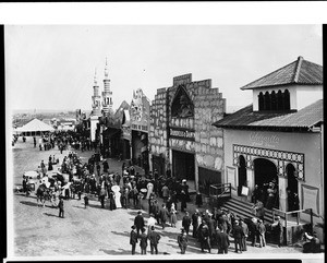 Pedestrians enjoying the sideshows along the Midway by the Venice Lagoon, 1910