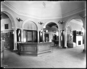The reference (service?) desk area inside the Pomona Public Library, ca.1900