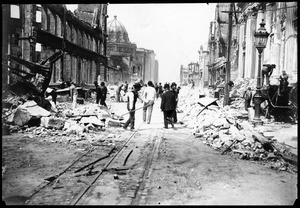 McAllister Street near Market Street, showing men cleaning the earthquake debris in San Francisco, 1906