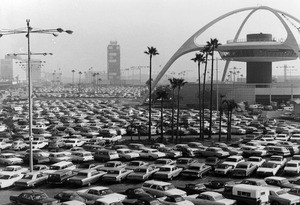 Exterior view of the Los Angeles International Airport, looking toward the tower, showing parking lots, February 25, 1971