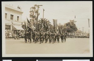 Soldiers marching in a parade, ca.1920