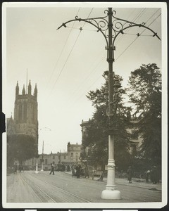 Street lighting posts near a trolley track, England, ca.1930