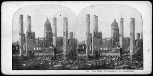 San Francisco earthquake damage, showing aphotographer shooting City Hall through the ruins, 1906