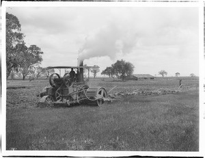 Two men operating a steam plow in a field near Hanford, Kings County, ca.1900