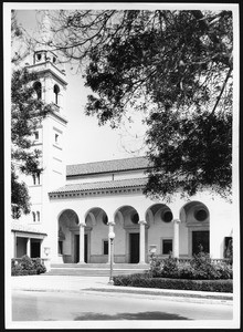 Exterior view of the Thirteenth Church of Christ Scientist, shown through a veil of trees, ca.1920-1950