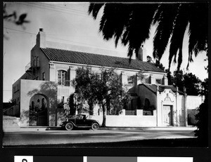 Exterior view of the Jewish Women's Club, showing a parked automobile, August 1927