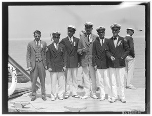 Eight men on a dock