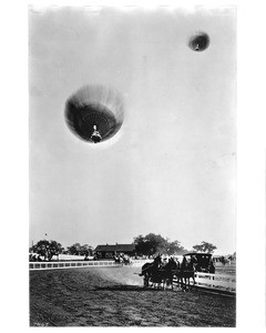 Race between hot-air balloons and horse-drawn chariots (possibly at the Tournament of Roses Parade), ca.1917