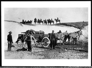 American soldiers gathering up dead Sioux Indians after the Wounded Knee Massacre in South Dakota, 1892