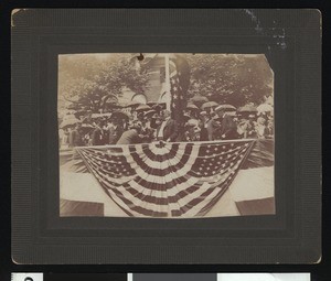 Dignitary in a flag-draped area, ca.1900