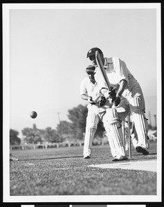 Two cricket players in Griffith Park, ca.1950