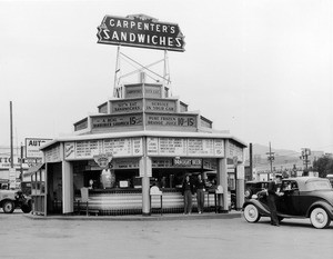 Exterior view of the Carpenter's Sandwiches restaurant at the corner of Sunset Avenue and Vine Street, ca.1920-1929