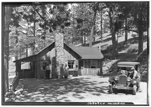 People at a cabin in Big Pines Recreational Camp