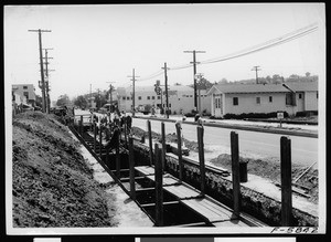 Men constructing a storm sewer