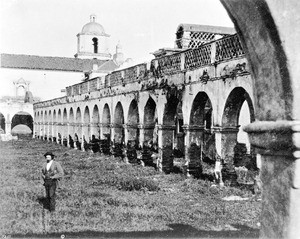 Exterior view of the Mission San Luis Rey de Francia looking from the west arch and taken by photographer Edward Vischer, San Diego, before 1875