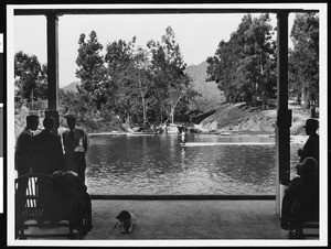 Women fishing, shown from a patio, at Rainbow Angling Club, Azusa, ca.1930