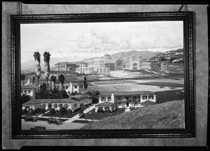 Painting of group of unidentified buildings, showing a large mission in the background