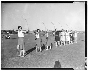 Women lined up to practice archery at the University of California, Los Angeles, ca.1930