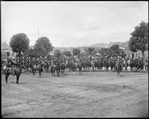 Spanish caballeros and caballeras, riding on horses near the Plaza Church during La Fiesta de Los Angeles, ca.1901