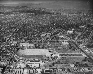 Aerial view of the Los Angeles Memorial Coliseum looking north from Olympic Park between Vermont Avenue and Hoover Street, February 12, 1932