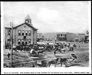 Auction of a Pasadena school building on the corner of Colorado Street and Fair Oaks Avenue, ca.1885