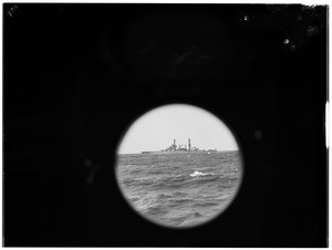 View through a porthole of a battleship at sea