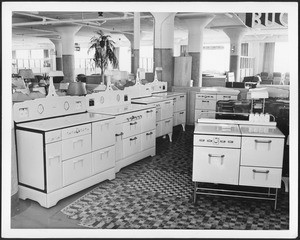 Interior view of a furniture and appliance store selling stoves