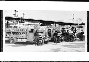 View of Arrowhead Water Company trucks and drivers, 1930-1940