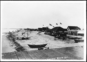 Fishing boats and beach shops at Newport beach, shown from a pier, ca.1908